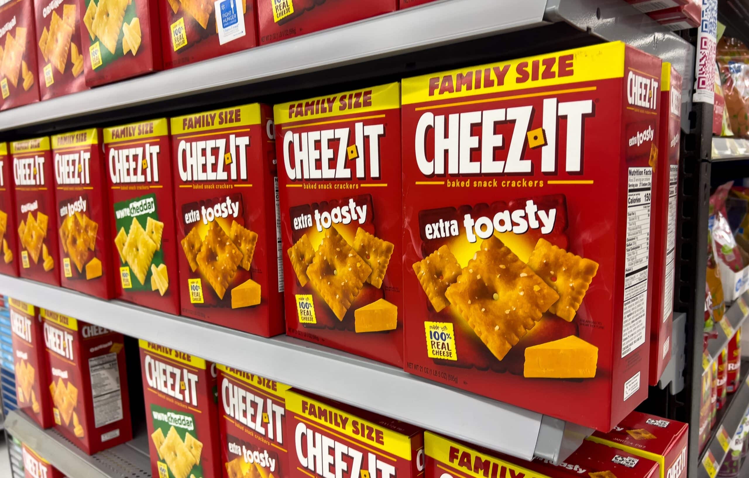 Cheez-It extra toasty family size boxes displayed on a grocery store shelf.