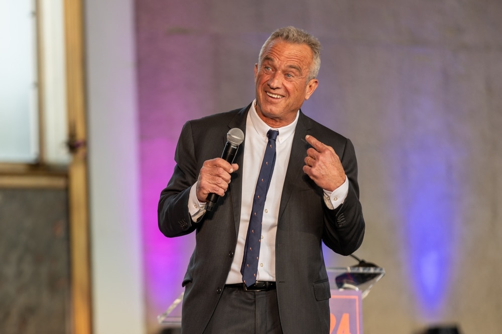 Robert F. Kennedy Jr. speaking into microphone during public event.