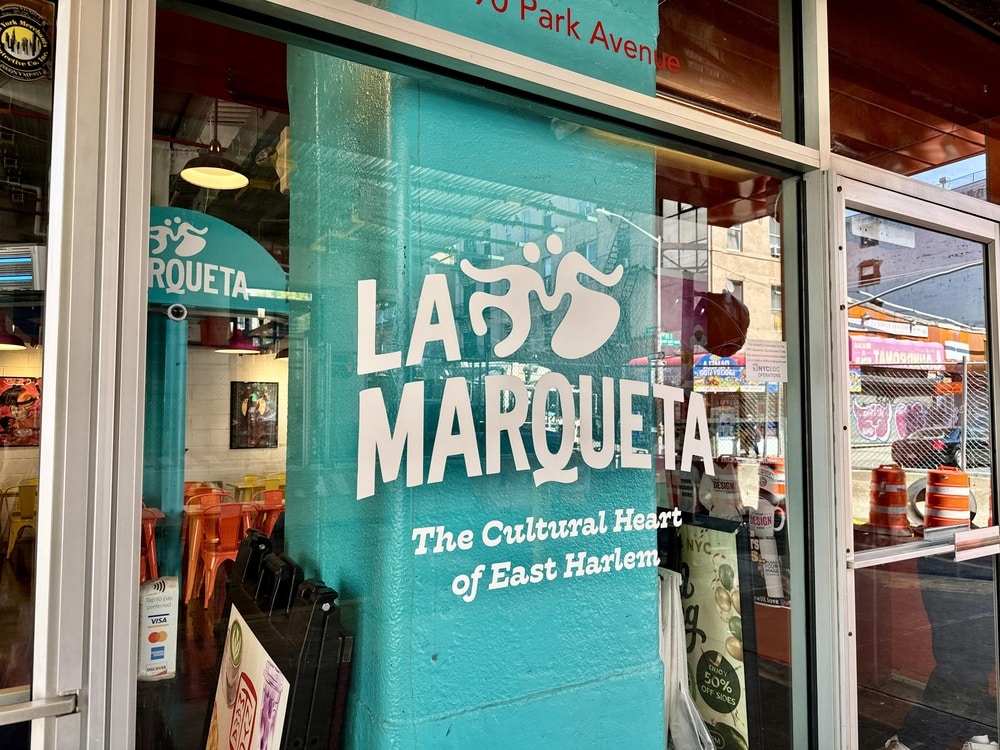 Close-up of La Marqueta storefront sign.
