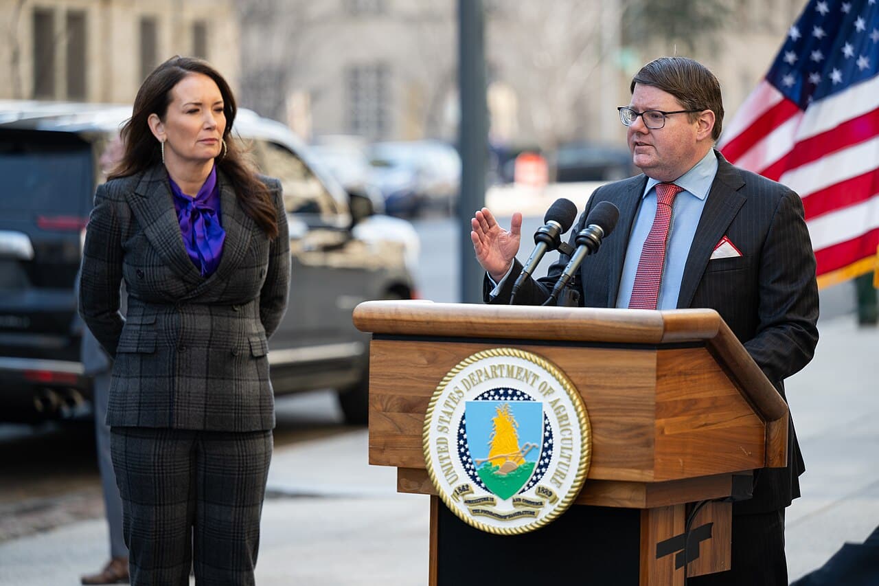 Deputy Agriculture Secretary Stephen Vaden speaks at a podium alongside Agriculture Secretary Brooke Rollins during a USDA announcement in Washington, D.C.