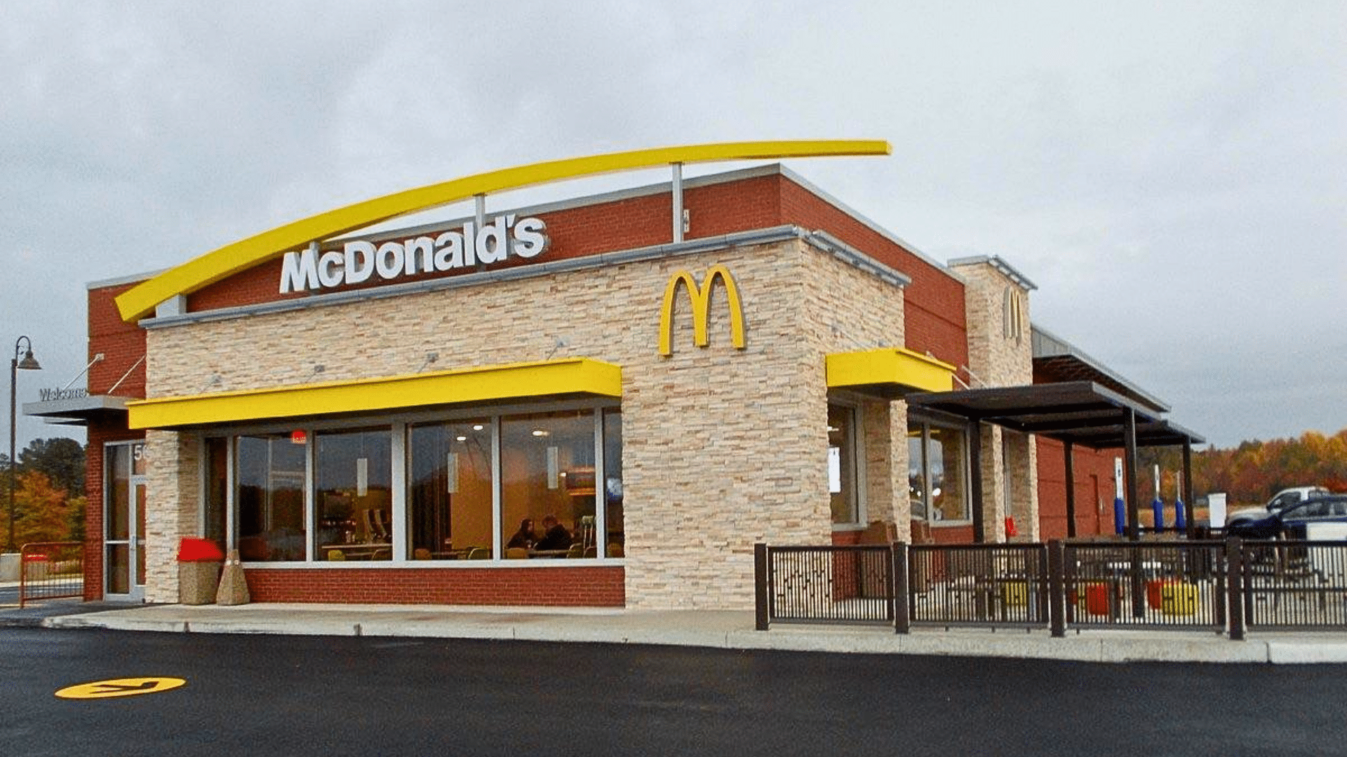 McDonald’s restaurant exterior with golden arches and drive-thru area.