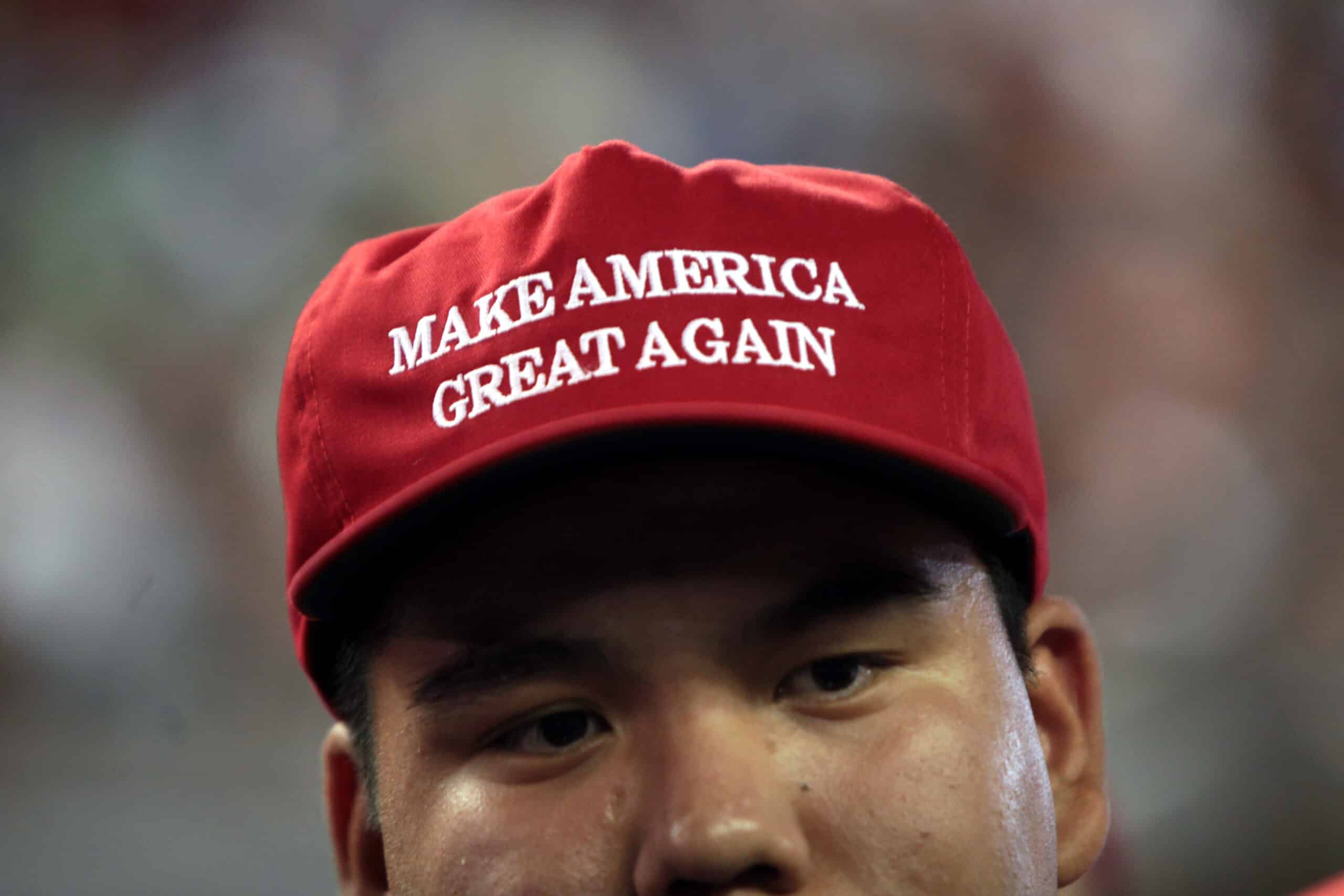 Make America Great Again hat in support of Donald Trump at a rally at Veterans Memorial Coliseum at the Arizona State Fairgrounds in Phoenix, Arizona.