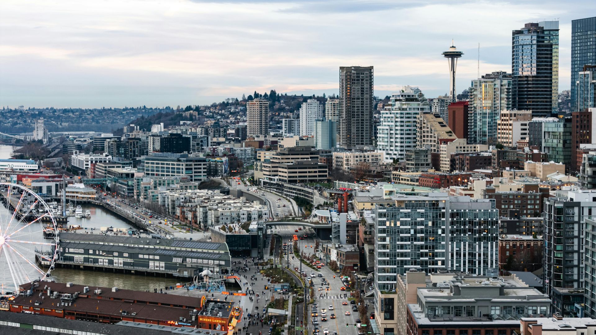 Aerial view of downtown Seattle featuring the iconic Space Needle and urban skyline.
