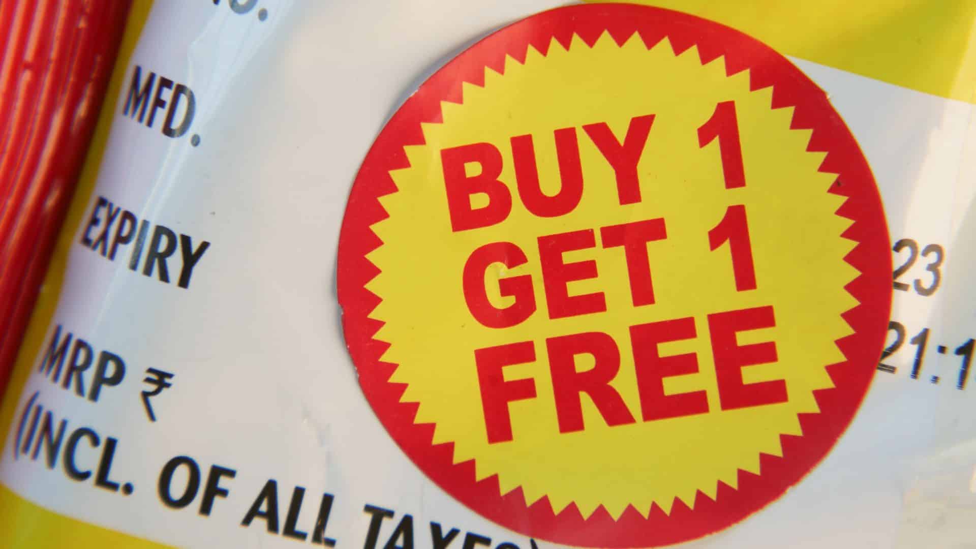 Close-up of a package with a bold red and yellow sticker reading "BUY 1 GET 1 FREE," conveying a promotional offer.