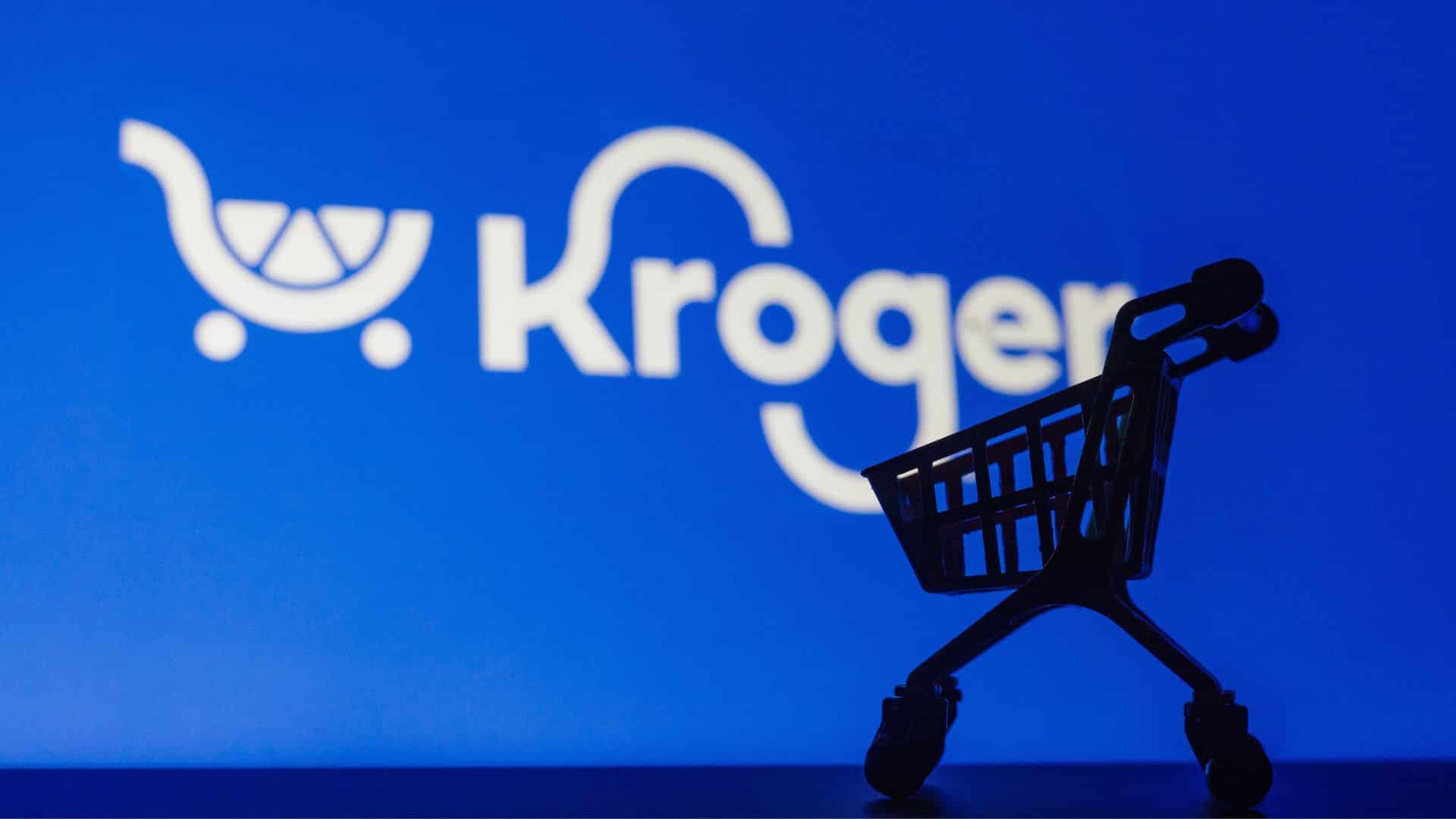 Kroger logo on blue background with small shopping cart silhouette in foreground.