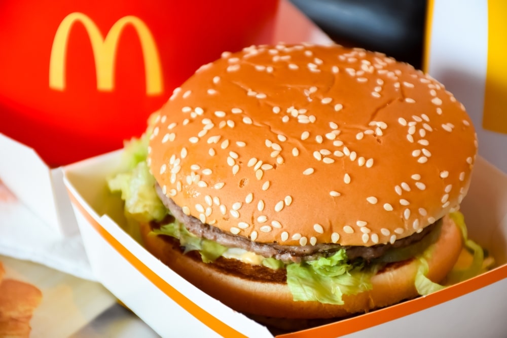 McDonald’s hamburger displayed in branded packaging.