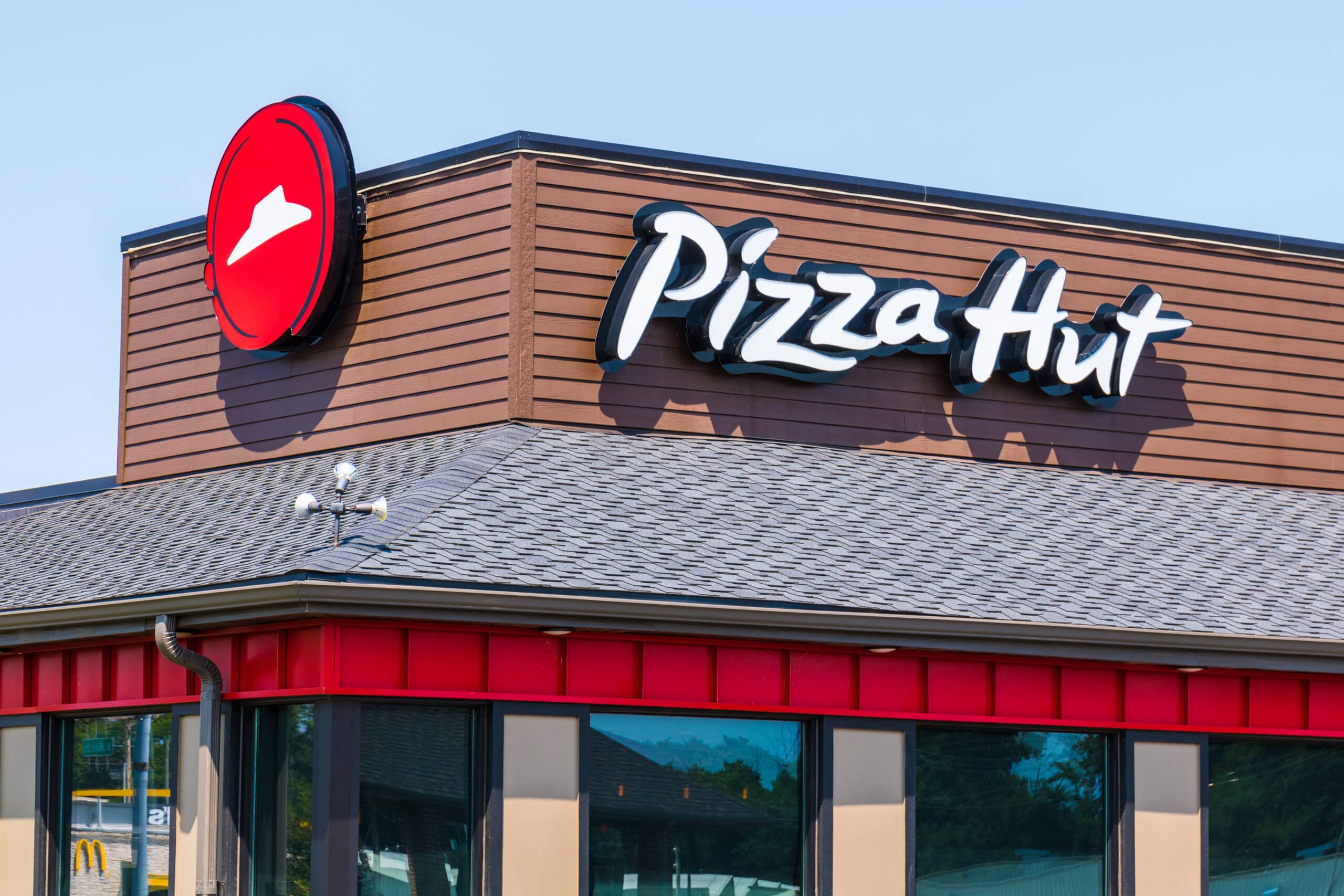 Pizza Hut restaurant exterior displaying the company logo and storefront signage.
