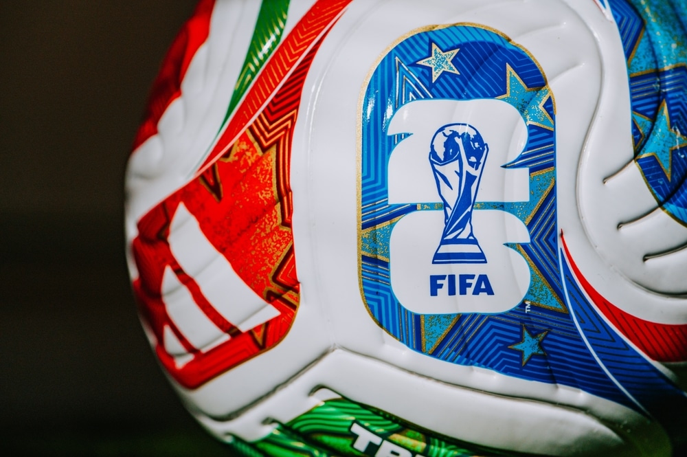 Close-up of a FIFA-branded soccer ball featuring the FIFA Club World Cup trophy logo.
