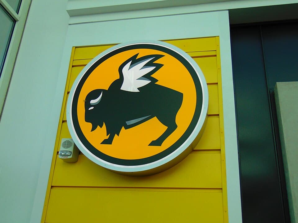 The Buffalo Wild Wings buffalo mascot logo displayed on a restaurant storefront sign.