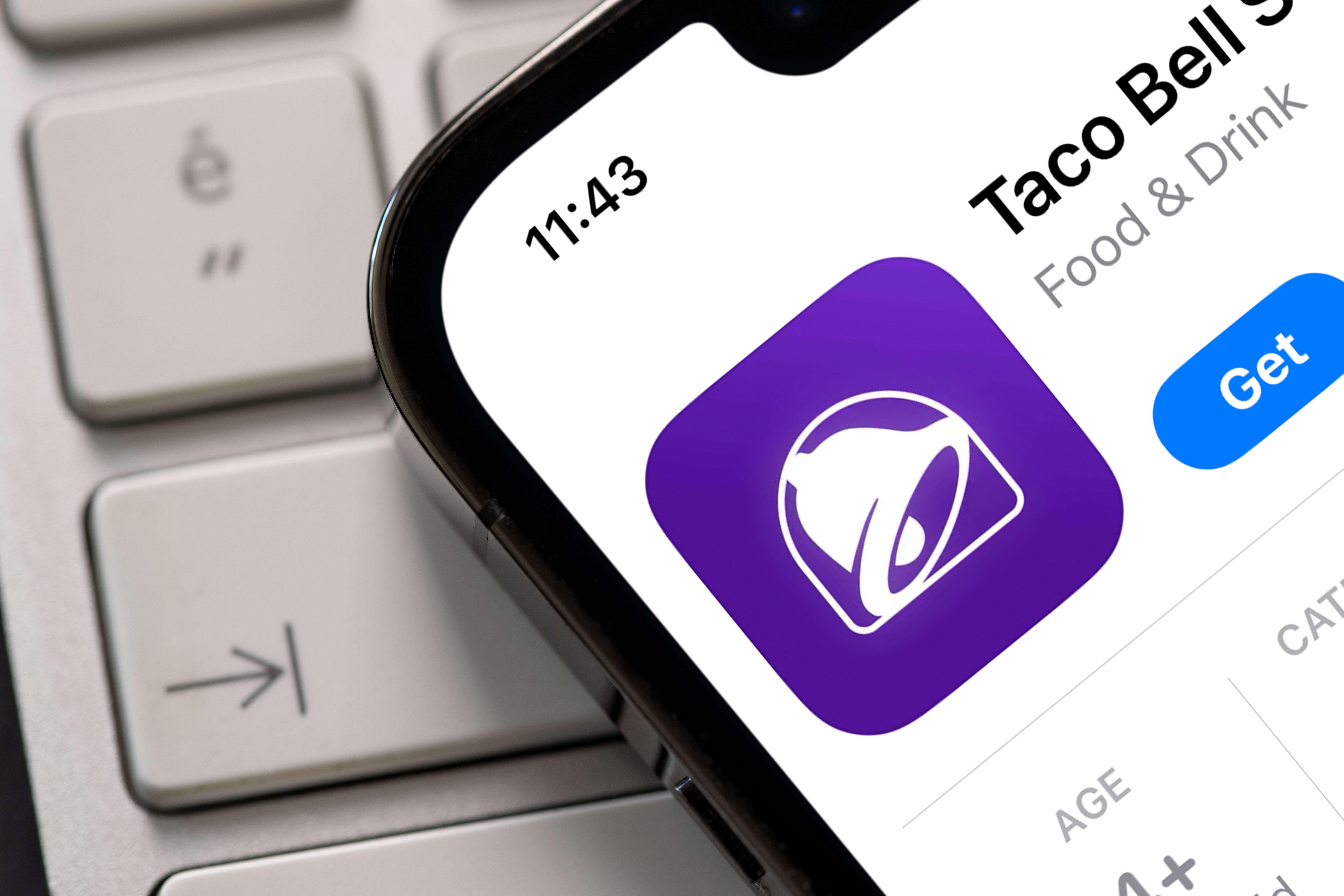 Taco Bell app listing displayed on a smartphone screen.
