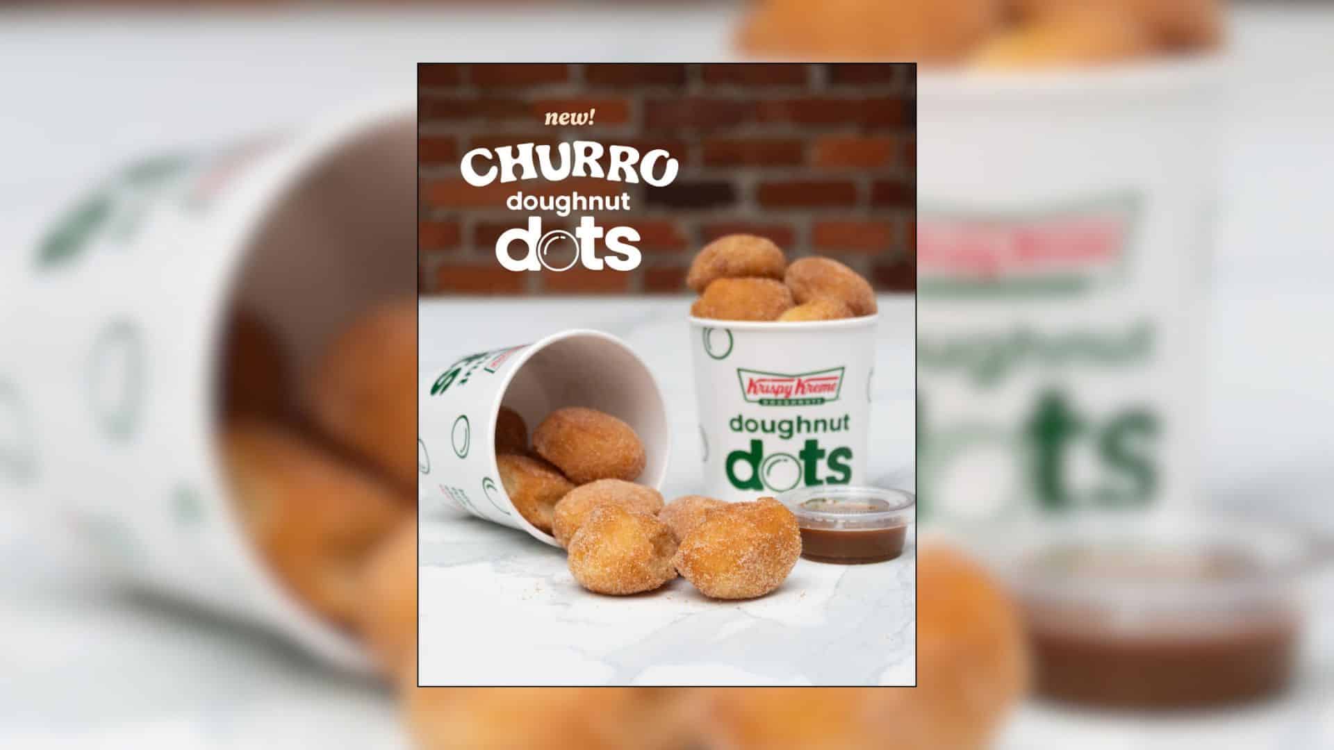 Krispy Kreme Churro Doughnut Dots coated in cinnamon sugar, served in branded cups alongside a dipping sauce.