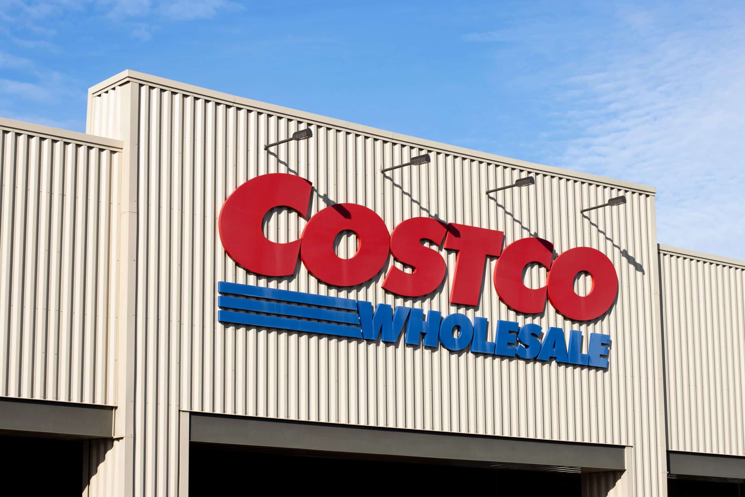 Costco Wholesale logo displayed prominently on the exterior of a warehouse store.